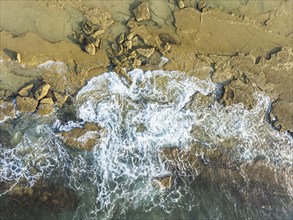 Breakers at the shore of the Atlantic Ocean near Cape Trafalgar. Aerial view. Drone shot. Costa de