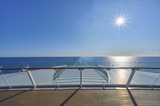 View from the ship's deck, Mein Schiff 6, of the vast sea under bright sunshine and blue skies,