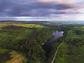 Sunset over Cod Beck Reservoir from a drone, North York Moors National Park, North Yorkshire,