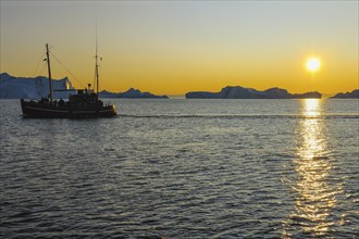 Excursion boat on fjord Ilulissat, Icefjord, Disko Bay, Qaasuitsup, Greenland, Polar Regions,