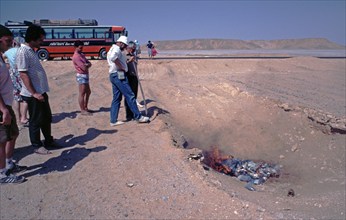 Waste is burnt in the desert, Rotel-Tours bus, passengers, waste incineration, Libyan Desert,