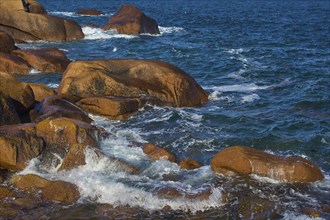 Large granite rose rocks, in the middle of the sea, lapped by waves, Ploumanach, Cote De Granit