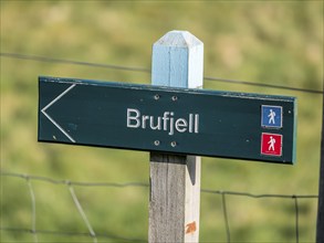 Signpost showing direction to brufjell caves, near Ana-Sira west of Flekkefjord, Norway, Europe