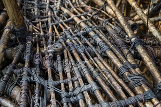 Close-up of a complex bamboo installation with ropes, bamboo sculpture by Doug and Mike Starn, art