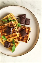 Viennese waffles, with chocolate, breakfast, on a beige background, no people, selective focus,