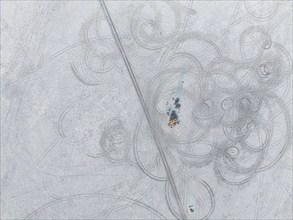 Tyre tracks in the salt pan, top-down, aerial view, Kubu Island, Botswana, Africa