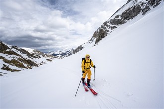 Ski tourers ascending from the Iffigtal to the Wildhornhütte, snow-covered mountain landscape,