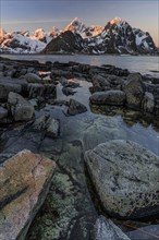 Sunrise, morning light, steep mountains by the sea, winter, Flakstadoya, Lofoten, Norway, Europe