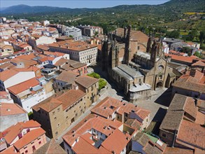 Historic city with an impressive cathedral, surrounded by narrow streets and old stone buildings