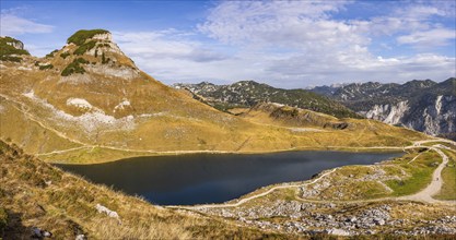 Panorama. Lake Augstsee and the Atterkogel mountain on the Loser. View of other mountains. Autumn,