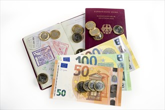 Banknotes, symbolic photo of bribery, passports of the Federal Republic of Germany