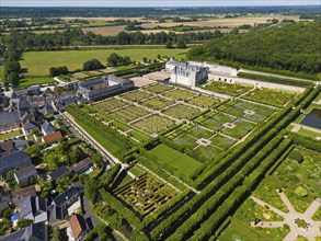 Extensive gardens of a castle with geometric patterns, surrounded by nature, aerial view, Villandry