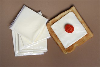 Cheese slices with toast, processed cheese in packaging