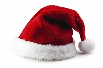 Red santa hat with white pompon on white background. Generative Ai, AI generated