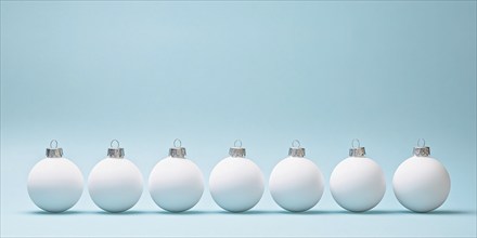 White Christmas tree baubles in a row on pastel blue background. Generative AI, AI generated