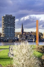 Ruhr estuary in the Rhine, high-rise building with hotel in Duisburg Homberg, sculpture Rhine