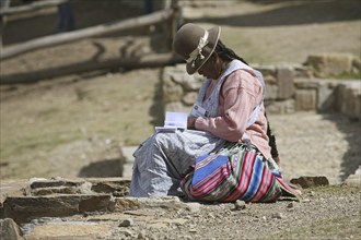 Traditional dressed Bolivian woman with bowler hat in Bolivia