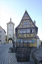 Siebersturm as part of the historic town fortifications and yellow half-timbered house, town gate,