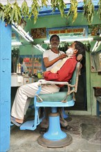 Hairdresser at work, Bharatpur, Rajasthan, India, Asia