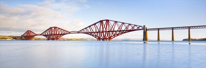 View of the red railway bridge Forth Bridge at the Fírth of Forth estuary near South Queensferry,