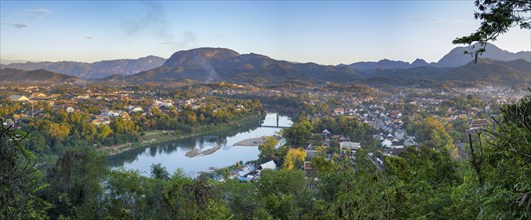 Panorama over Luang Prabang with Nam Khan River and Wat Phol Pao in the background, Laos, Asia