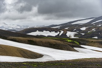 Volcanic landscape with hills and snow, Laugavegur trekking trail, Landmannalaugar, Fjallabak