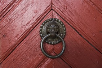 Red wooden door, door handle, Skarð á Skarðsströnd vicarage, Dalabyggð, Klofningsnes peninsula,