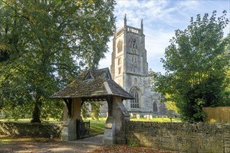 Lychgate and tower of village parish church of Saint Mary, Kempsford, Gloucestershire, England, UK