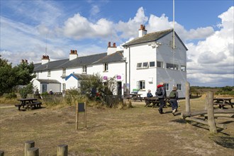 People at Coastguard Cottages, Dunwich Heath, Suffolk, England, UK