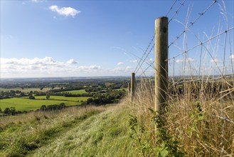 Low angle view fence posts Vale of Pewsey, Pewsey Vale, Martinsell Hill, Oare, Wiltshire, England,