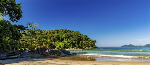 Castelhanos beach with sea, forest and mountains on the island of Ilhabela in Sao Paulo,