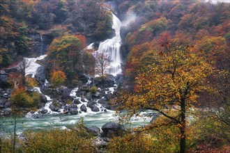 Waterfall in autumn-coloured Verzasca Valley, Verzasca River, Canton Ticino, Switzerland, Europe