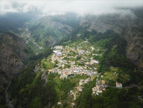 Aerial drone view of Curral das Freiras village in Valley of the Nuns from Miradouro da Eira do