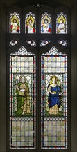 Stained glass window of Saint John (by William Morris) and Saint Mary (by Edward Burne-Jones) c