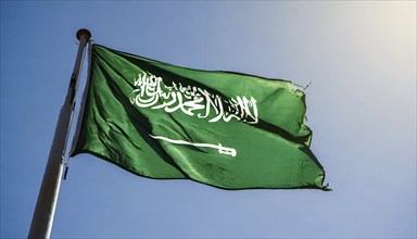 Flag, the national flag of Saudi Arabia flutters in the wind