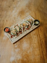 Mexican pork carnita tacos on wooden table with copy space. Homemade Mexican tacos al pastor with