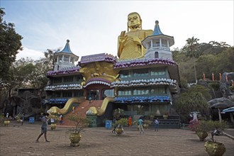 Buddha statue at the entrance to the Dambulla cave temple, Dambulla, Central Province, Sri Lanka,