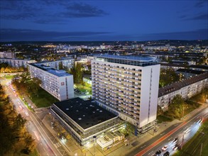 Street crossing Pirnaischer Platz at night, with renovated high-rise building, Aerial view,