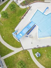 Close-up of an outdoor pool with swimming pool, slides and surrounding lawns, Calw outdoor pool,