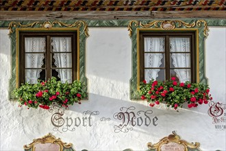 Typical Lüftlmalerei around window with geraniums, Wallgau, Werdenfelser Land, Upper Bavaria,