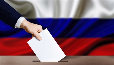 Hand holding ballot in the ballot box with Russia flag in the background. Presidential elections of