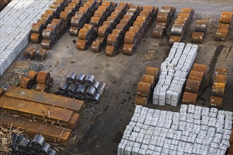 Top view of aluminium ingots and coils of flat rolled steel waiting for shipment at a terminal in