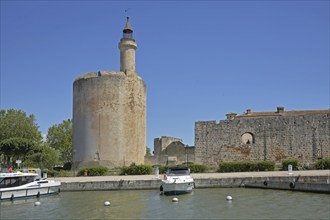 Marina with yachts and Tour de Constance, defence defence tower and landmark, historic town