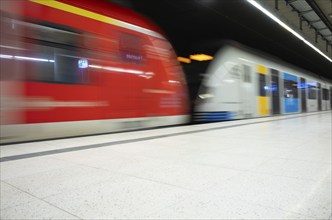 Underground arriving S-Bahn, train, class 420 in traffic red, coupled with Generation 2024,