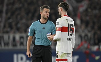 Referee Daniel Schlager in discussion with Atakan Karazor VfB Stuttgart (16) MHPArena, MHP Arena