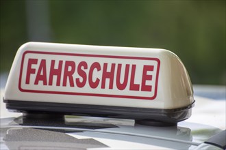 Close-up of a driving school sign in Germany