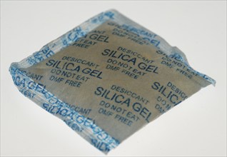 Silica gel, desiccant, is often used in packaging for technical devices, packed in small bags,