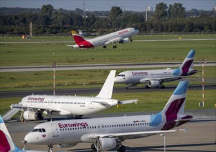 Düsseldorf Airport, Eurowings aircraft, on the taxiway and parking position, Iberia aircraft taking