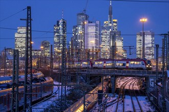 Railway tracks in front of the main railway station in Frankfurt am Main, skyline of skyscrapers in