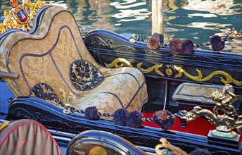 Luxury Gondola waiting for tourists near famous Rialto Bridge in Venice